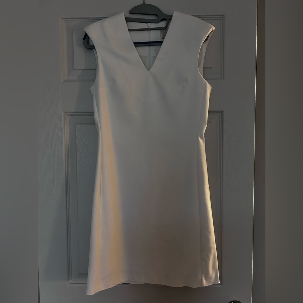 White dress with padded shoulders
